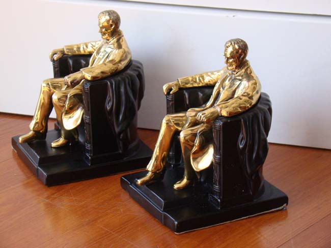 A pair of "Lincoln in the chair" bookends by P M Craftsman circa 1960